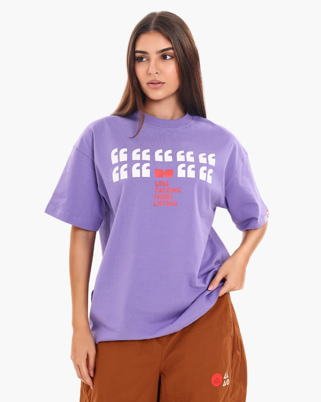 Woman wearing a purple oversized unisex t-shirt