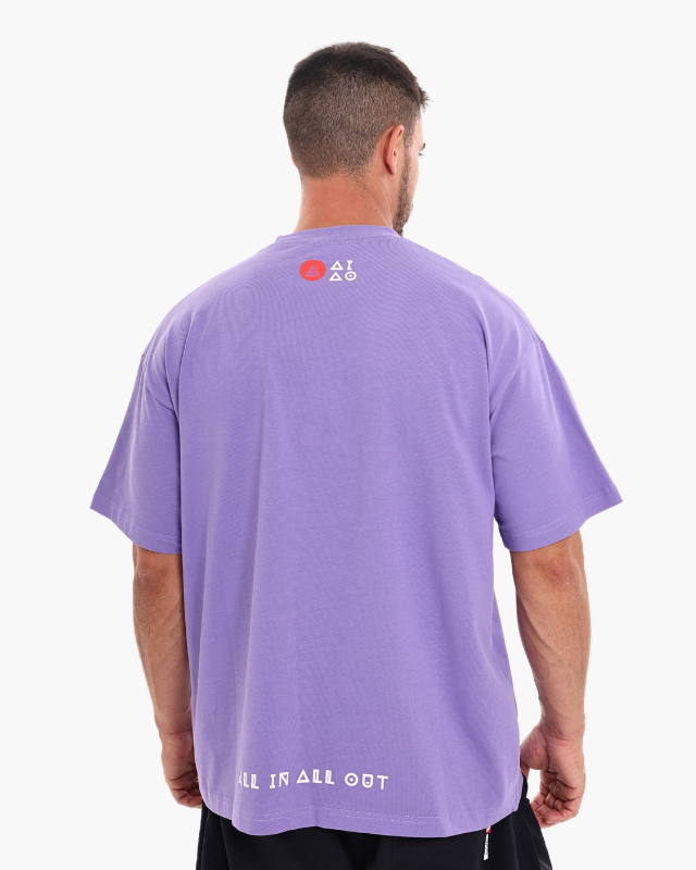 Man wearing a purple oversized unisex t-shirt back pose