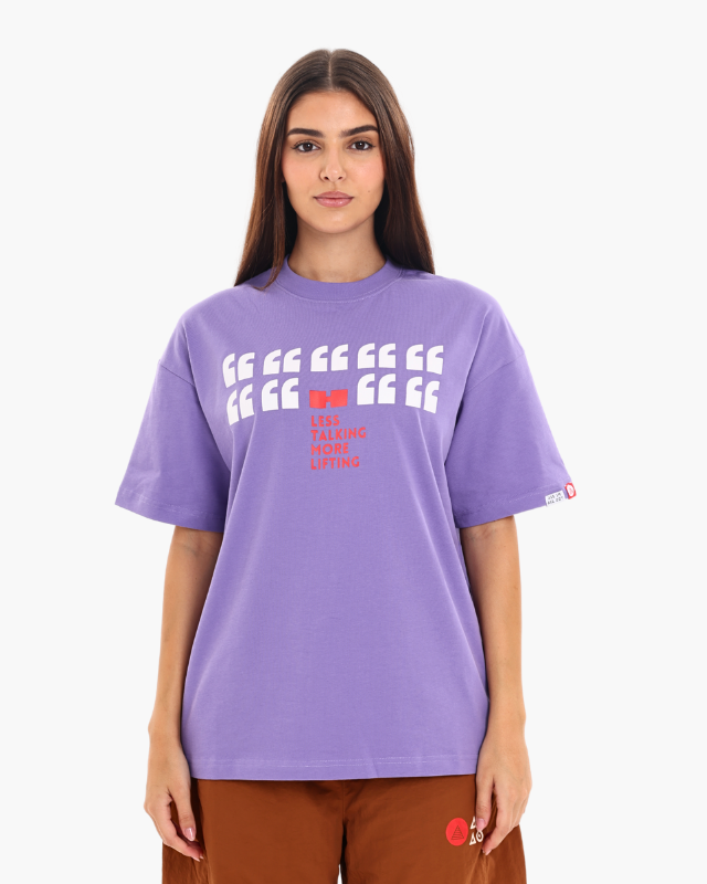 Woman wearing a purple oversized unisex t-shirt front pose