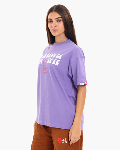 Woman wearing a purple oversized unisex t-shirt side pose